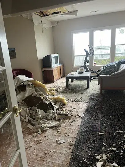 A water-damaged room cleared for restoration in a White Plains, NY home